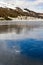 Frozen lake with ice crack on surface