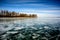 Frozen Lake Khubsugul. Beautiful forest near the ice surface on a frosty day. Natural background