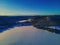 Frozen lake in the Norwegian wilderness, covered in undisturbed snow