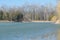 Frozen lake in spring time at Memorial Park Constantin Stere in Bucov, near Ploiesti, Romania