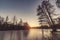 Frozen lake with tree silhouttes on the shore