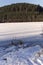 Frozen lake in a winter landscpae on a sunny day