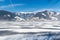Frozen lake Zeller and snowy mountains in Austria