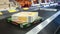 Frozen Lemon Meringue Pie and Pepperoni Pizza on checkout conveyor belt in shop