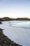 Frozen Loch Mhic Leiod on Dava Moor in the Highlands of Scotland.