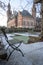 Frozen lonely chair at Peace Palace garden, International Court of Justice, under the Snow