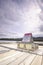 Frozen Maligne Lake, wooden deck with a large sign in it, with the text, caution point canoe bow into tour boat wake