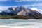 Frozen Mountain Lake Ice Covered Surface Rocky Mountain Peak Blue Sky Horizon Landscape