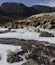 Frozen mountain stream nuranang chu river near sela pass