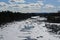 A frozen Niva river in sunny spring day