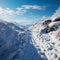 Frozen path Snowy footprints tell tale of hillside climb through cold terrain