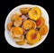 Frozen peaches apricot strawberries in a bowl isolated on black