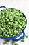 Frozen Peas in Blue Colander