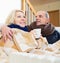 Frozen pensioners sitting on sofa