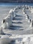 Frozen piling remnants of vintage pier on Cayuga