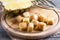 Frozen pineapple cubes on a chopping board