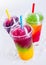 Frozen Rainbow Slush Drinks Chilling on Ice