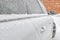 Frozen rearview mirror, snowy car. Winter, snow, snowfall