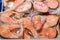 Frozen red fish in plastic vacuum packaging. Goods in the freezer of the store fridge. Close-up background