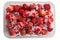 Frozen red strawberries, chilled ripe berries in a box isolated