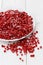 Frozen redcurrants on white ceramic plate on white painted table