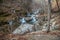 Frozen river and icicles in winter