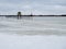 Frozen river and lifeguard booth. Effects of climate change