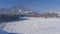 The frozen riverbed is covered with snow.