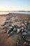 Frozen rocks on river bed in morning light