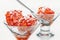 Frozen sea buckthorn berries in dessert glass cups, dessert spoon, vitamins.