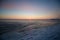 Frozen sea on sunset. Beautiful natural seascape on winter time. Endless ice to horizon. Ice surface for product placing