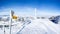 frozen signpost and cross at the summit of the snowy mountain. gorgeous mountain panorama in switzerland on fuerstein, swiss alps