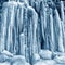 Frozen small mountain waterfall close up