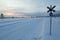 Frozen snowmobile track in a cloudy sunset, Lapland