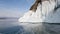 Frozen splashes of water at the rocky shore of Olkhon island. The journey to the winter lake Baikal. Siberian frosts in Russia