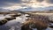 Frozen Stream In Snowy Mountains: A Captivating Arctic Landscape