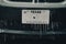 Frozen Texas license number with icicles. Icy frosty cover Black SUV car bumper and plate number in severe winter storm