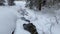 Frozen torrent in Trentino, full of snow