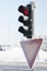 Frozen traffic light at winter showing red