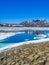 Frozen turquoise lake Vavatn panorama in summer landscape Hemsedal Norway