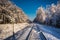 Frozen unused railway line in winter at sunrise