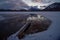 Frozen Vermillion Lake surrounded by Canadian Rocky Mountains.