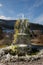 Frozen water on fountain, icicles on mossy fountain in Black Forest, Germany