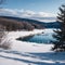 Frozen water of Lake Pepin with rocks and trees along the shoreline with hills in the distance at Pepin,