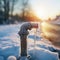 A frozen water pipe in winter, closeup, shallow depth of field. water tap covered with ice