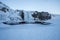 Frozen waterfall beside the Church Mountain Kirkjufell in winter in Iceland