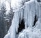 Frozen waterfall with icicles and snow near Bad Harzburg in the fir forests and spruce forests along the main road to Braunlage in