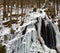 Frozen waterfall with icicles and snow near Bad Harzburg in the fir forests and spruce forests along the main road to Braunlage in