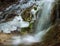 Frozen wild waterfall in the mountains