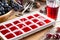 Frozen wine. Wine in ice cube tray on a wooden table